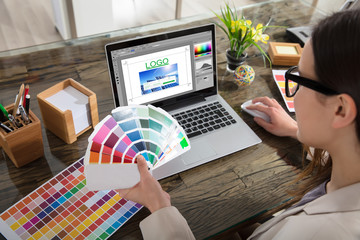 Business Woman Making Color Selection For Logo Design