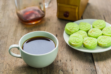 Coffee mug and dessert on wooden table
