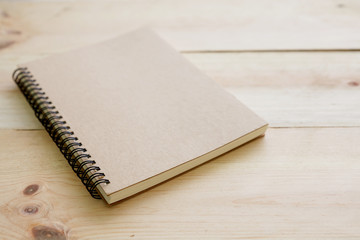 Fototapeta premium Book cover on textured wood background.