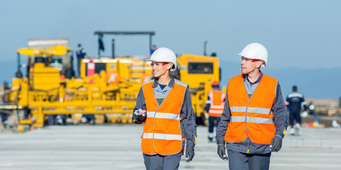Obraz na płótnie Canvas two engineers at airport runway