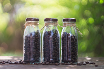 Coffee beans in glass bottle with selective focus point