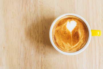 Coffee cup on wood table.