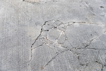 top view of cracks on concrete road