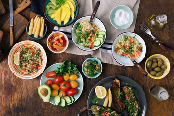 Vegetarian salad, vegetables, stuffed eggplant, fruit and snacks. Vegetarian food