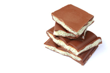 stack of pieces porous white and dark chocolate