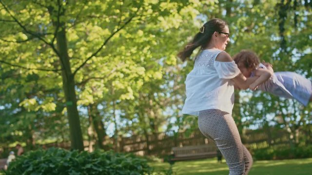 woman carrying her cute little daughter