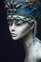 Woman in creative blue crown