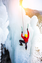 The climber climbs on ice.