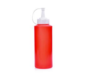 red plastic sauce bottle isolated on white background