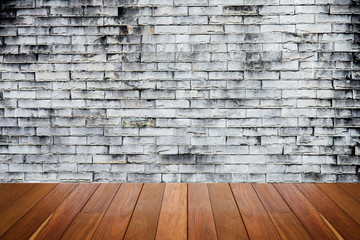 old  gray brick wall texture background.Rough brick wall.Background of old vintage dirty brick wall with peeling plaster, texture