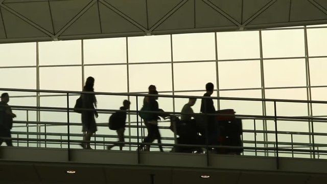 Silhouettes of Travellers in Airport