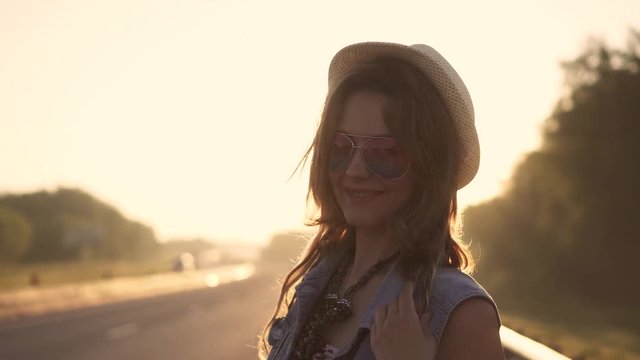 portrait of young beautiful girl in sunglasses. girl hipster at dawn