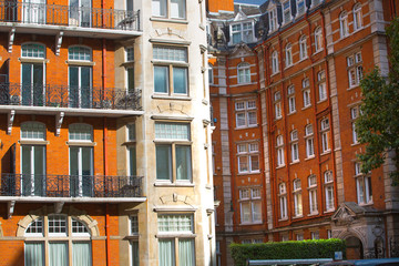 Windows of the luxury apartments in Kensington. Centre London residential buildings.  Kensington church street.