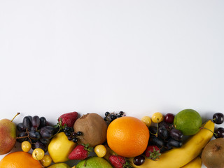 Close-up of Healthy eating background. Food photography different fruits  isolated white background. Copy space. Top view