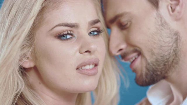 Sexy young couple posing on studio background, 4k slow motion studio clip