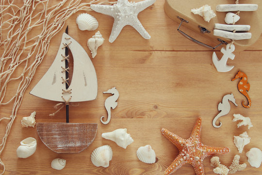 Nautical concept with sea life style objects on wooden table. Top view