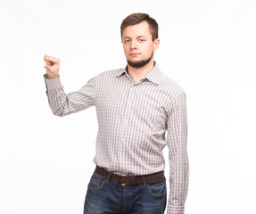 Young confident man portrait of a confident businessman showing presentation, pointing paper placard gray background. Ideal for banners, registration forms, presentation, landings, presenting concept.