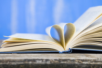 Open book on a wooden table
