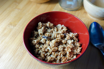 Bowl of cereal breakfast on wooden table