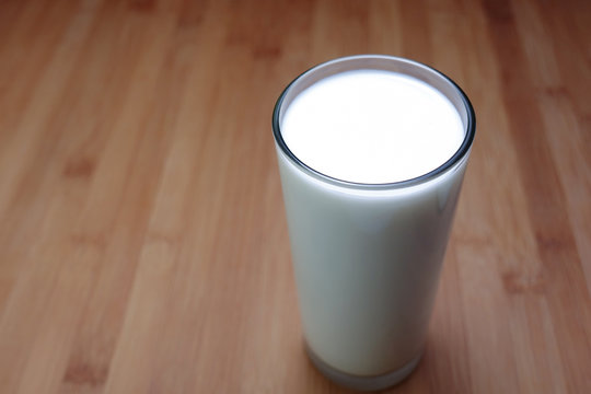 Glass of milk on table