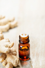 Ginger essential oil in the amber bottle