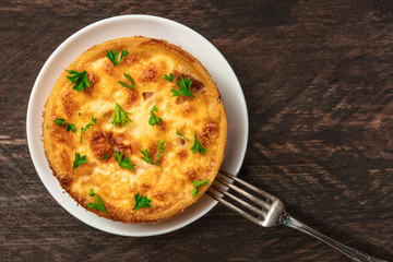 Overhead photo of French quiche on rustic texture
