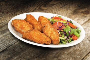 Fried chicken wings with salad