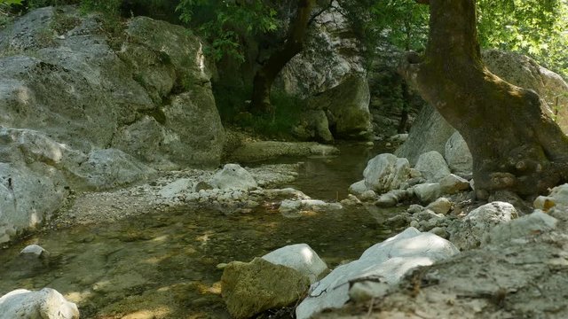 Small river in Epirus Mountains in Greece in summer day.