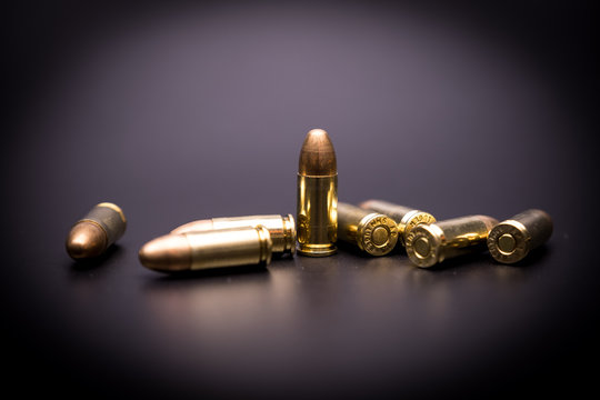 9 Mm Full Metal Jacket Bullet On Black Background