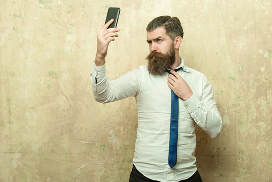 manager or bearded man with long beard speaking on phone