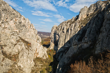 Play of light and shadows at sunset on rocks of Nisevacka gorge in east Serbia