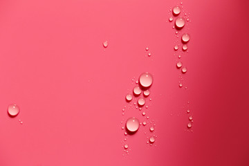 Close-up of water drops on red surface
