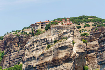 Fototapeta na wymiar Aerial daylight view on monastery at coast of mountains. Greece, Corfu island