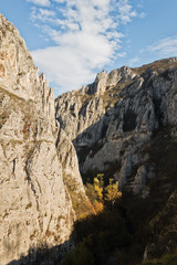 Play of light and shadows at sunset on rocks of Nisevacka gorge in east Serbia