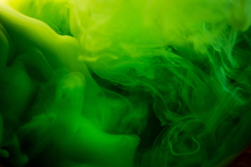 Fototapeta na wymiar green ink in water isolated on white background