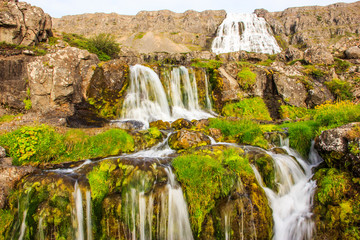 Obraz premium Beautiful summer view of Dynjandifoss (Dynjandi Waterfall), jewels of the Westfjords, Iceland. The biggest waterfall in Westfjords.