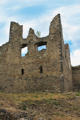 Corner of main building of old castle ruin Helfenburk. Czech landscape