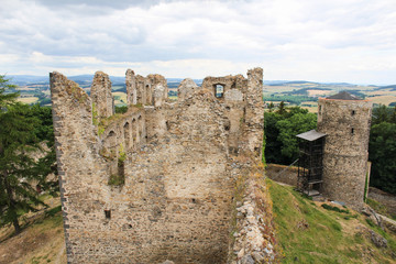 Fototapeta na wymiar Main building of old castle ruin Helfenburk from tower. Czech landscape