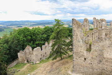 Fototapeta na wymiar Corner of main building of old castle ruin Helfenburk from tower. Czech landscape