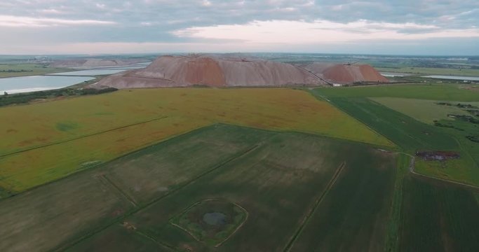 Salt piles. Aerial view of the mountains of sand and salt, view from height.
