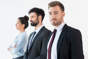 group of confident business people in formal wear isolated on white