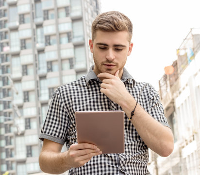 Business Man Holding Tablet  With Happy In Jobbusiness Man Holding Tablet  With In The City Back Ground