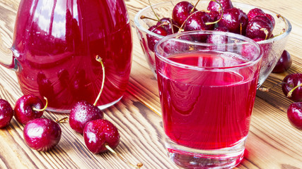 cherry juice in a glass and decanter