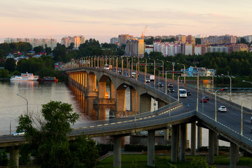 Summer city landscape with a bridge over the river