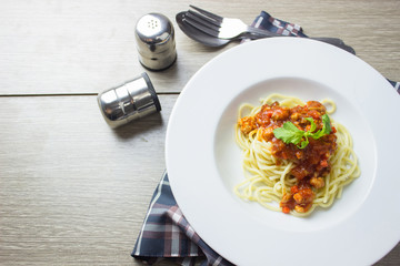 Spaghetti bolognese pasta with tomato sauce,homemade healthy italian pasta on wooden background