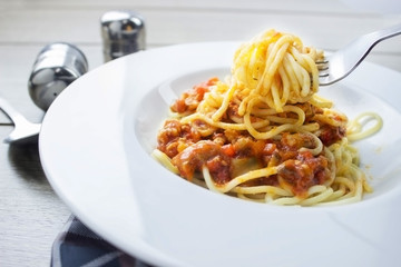 Spaghetti bolognese pasta with tomato sauce,Fork holding spaghetti
