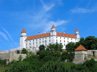 Fototapeta na wymiar Bratislava castle is one of the main dominants of city, it is included in list of national cultural monuments of Slovakia. This is massive rectangular building with four corner towers above Danube. 