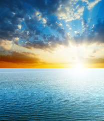 bright sunset over blue sea
