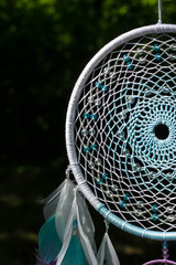 Dreamcatcher made of feathers, leather, beads, and ropes