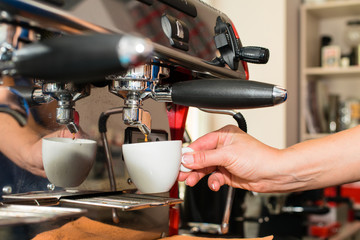 man holding pitcher. Barista prepares coffee